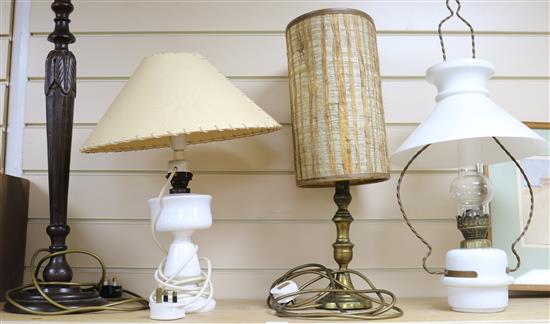 Two opaque white glass lamps and wood lamp base and another